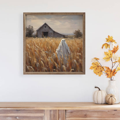 Framed wall art painting of ghost in golden wheat field with rustic barn