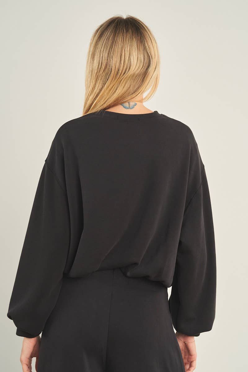 ANWND black oversized cropped crewneck sweatshirt with balloon sleeves, back view