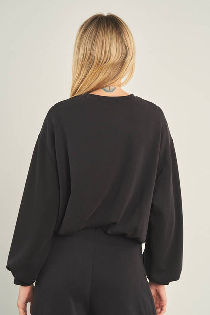 ANWND black oversized cropped crewneck sweatshirt with balloon sleeves, back view