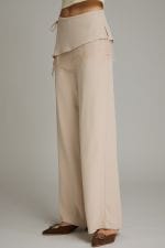 Entro wide-leg beige pants with side lace trim and layered waistband detail