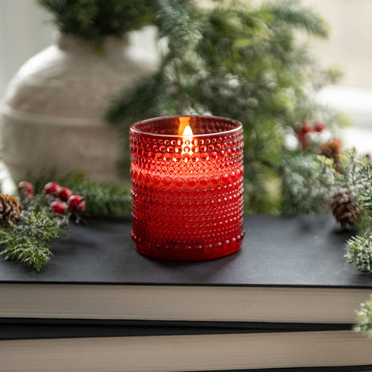 Red hobnail glass battery operated candle with warm flickering flame glow