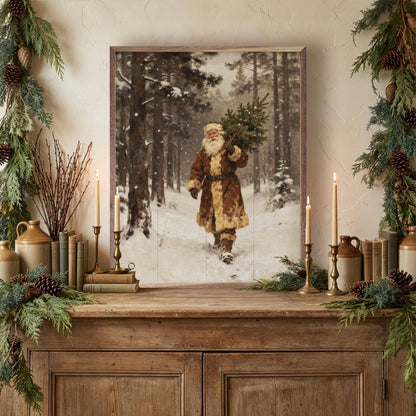 Framed vintage Santa carrying Christmas tree print displayed on rustic wooden sideboard