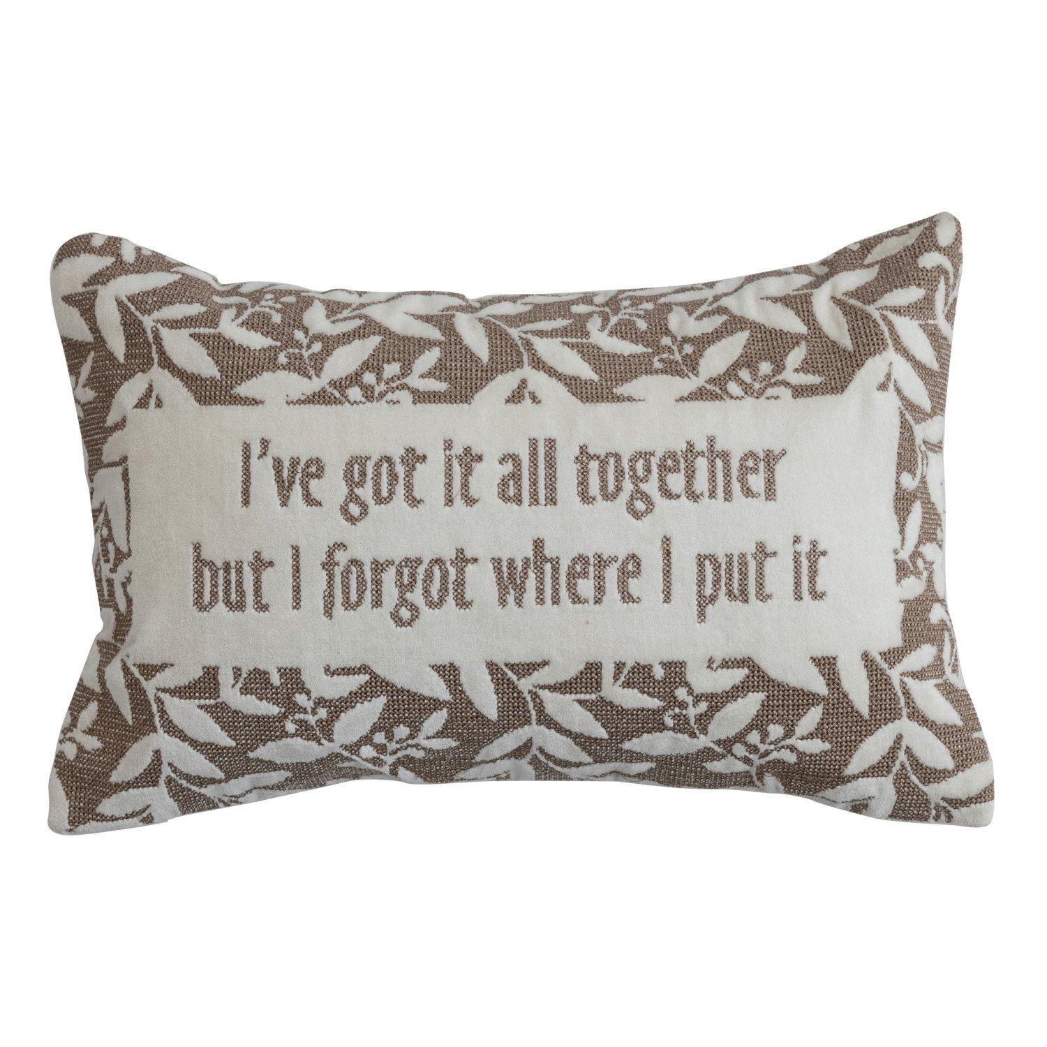 Rectangular decorative pillow with floral border and humorous quote about forgetfulness