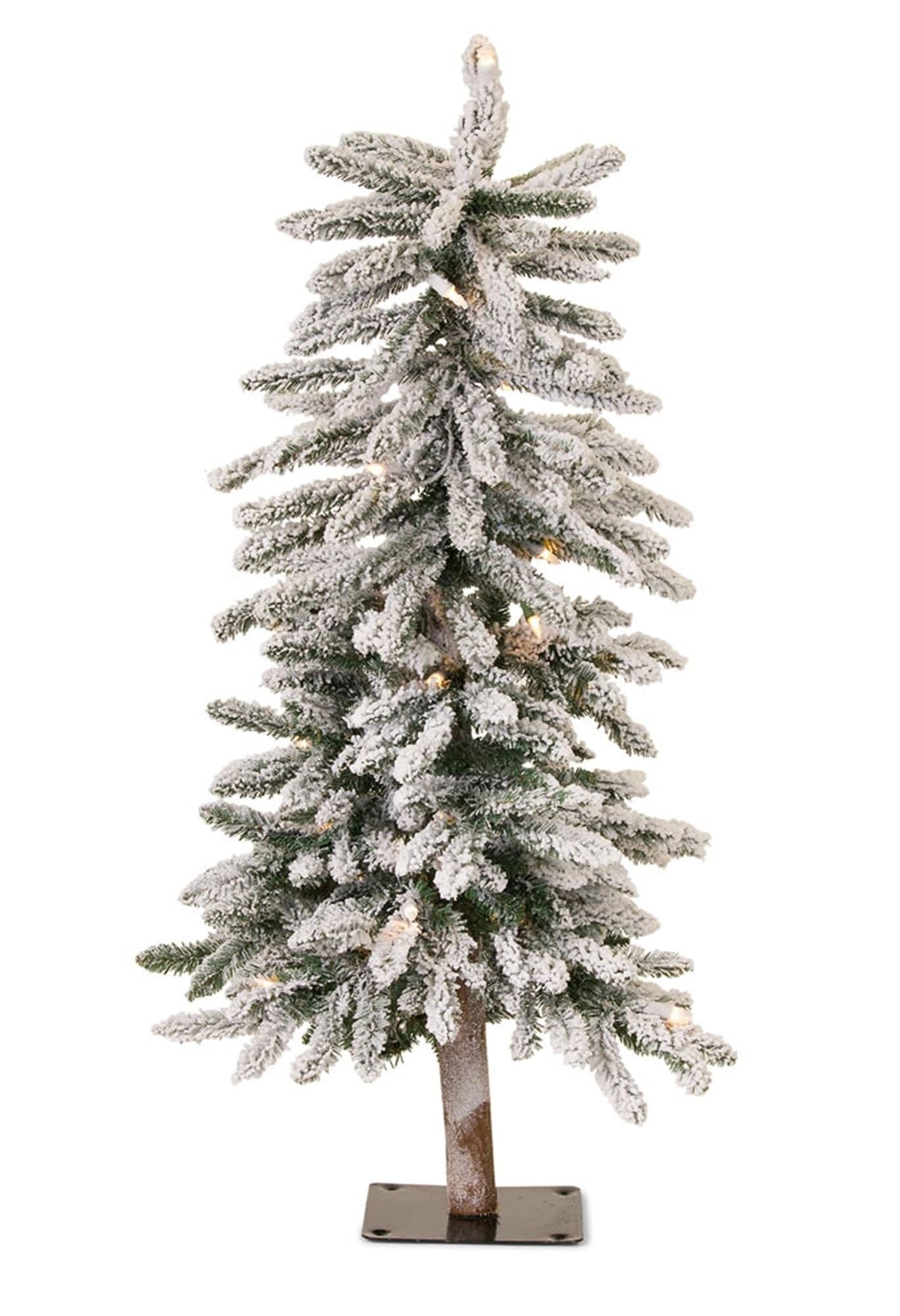 Snow-flocked artificial alpine Christmas tree with warm white lights on metal stand