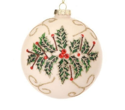 Cream glass ball ornament with painted holly leaves, red berries, and gold glitter vine