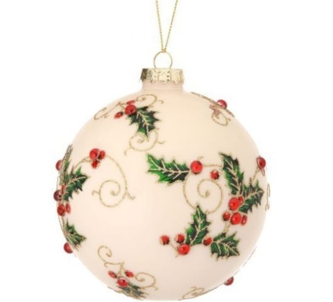 Cream glass ball ornament with holly leaves, red berries, and gold vine details