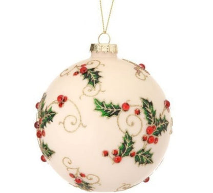 Cream glass ball ornament with holly leaves, red berries, and gold vine details