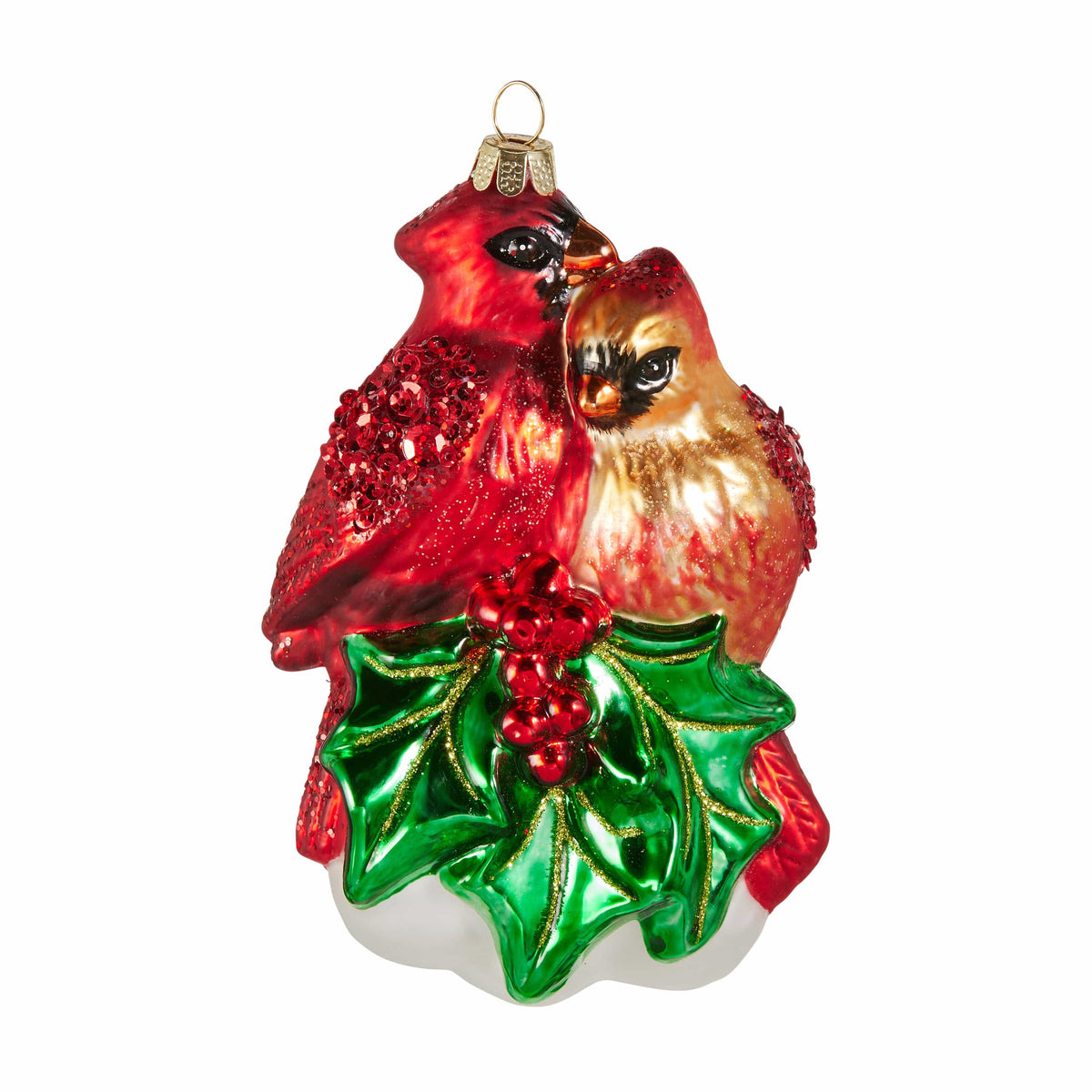 Glass Christmas ornament featuring a cardinal pair perched on holly leaves with red berries