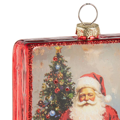Rectangular glass ornament with vintage Santa and decorated Christmas tree, red glitter border, metal hanging loop