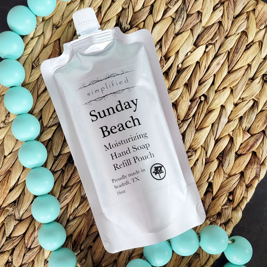 White frosted 16oz Sunday Beach moisturizing hand soap refill pouch on woven mat