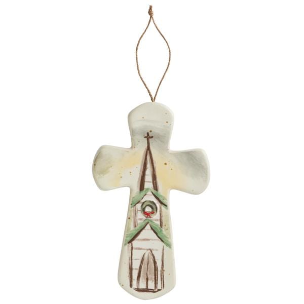 Cross-shaped ceramic ornament with painted church steeple and Christmas wreath, hung with twine
