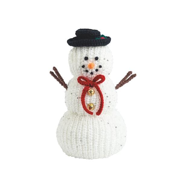 Knitted white snowman figurine with black top hat, red bow, gold bells, and twig arms