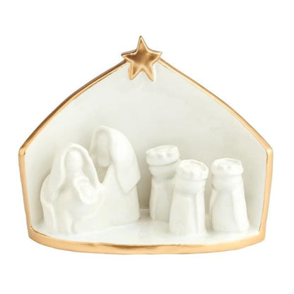 White ceramic nativity scene with gold trim edges and star, featuring Holy Family and Three Wise Men figurines
