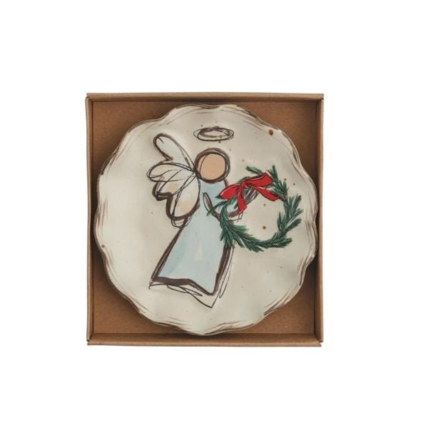 Ceramic tidbit plate with illustrated angel holding a Christmas wreath, displayed in kraft gift box