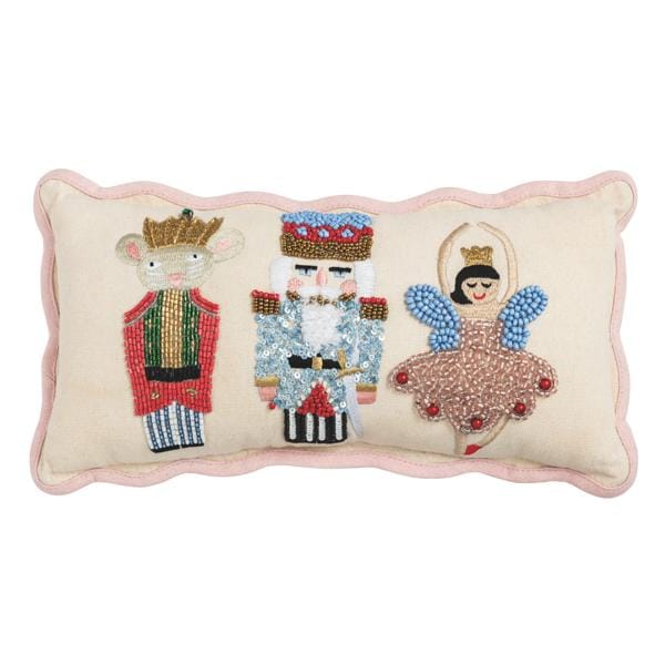 Rectangular lumbar pillow with beaded Nutcracker, Mouse King, and ballerina figures on cream background