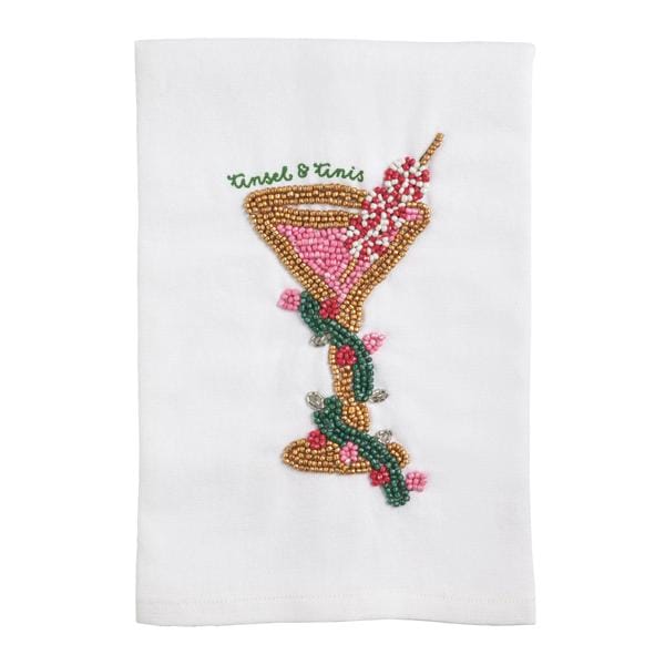 White cotton towel with beaded martini glass wrapped in green garland and pink flowers