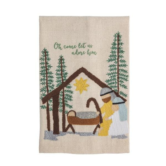 Embroidered linen towel featuring a nativity scene with manger, pine trees, and 'Oh come let us adore him' text