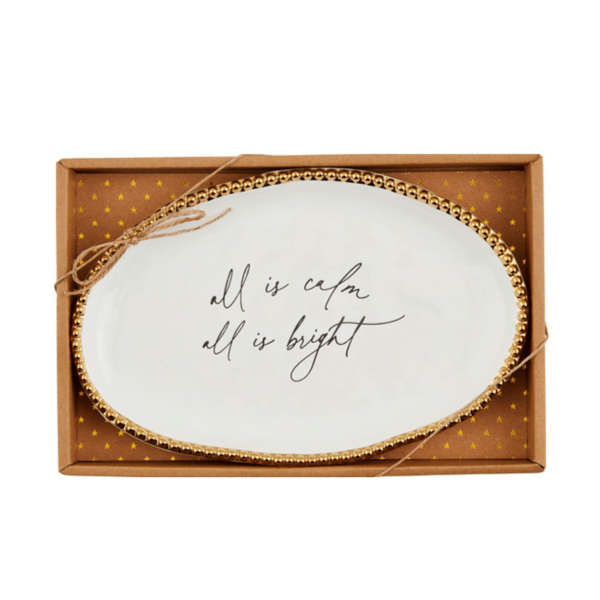 Oval white ceramic plate with gold beaded rim reading 'all is calm all is bright' in gift box