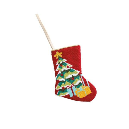 Red needlepoint Christmas stocking featuring an embroidered Christmas tree with gifts underneath