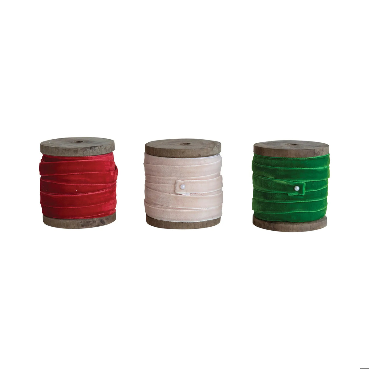 Three wooden spools of velvet ribbon in red, blush pink, and green, 10 yards each