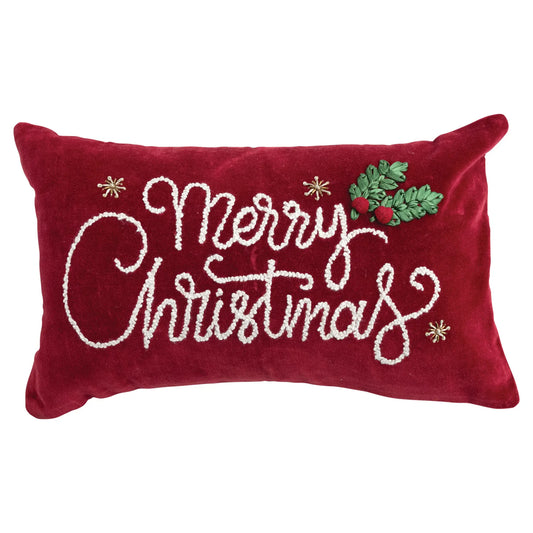 Red velvet lumbar pillow with white embroidered Merry Christmas script and holly applique