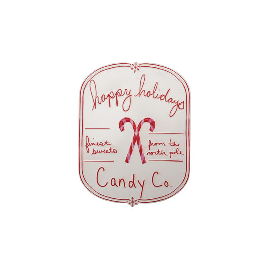White and red embossed metal sign Happy Holidays Candy Co. with candy canes