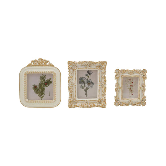 Set of three white and gold baroque resin photo frames with botanical prints