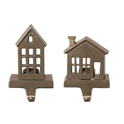 Two gold cast aluminum house-shaped tealight stocking holders, tall and short styles