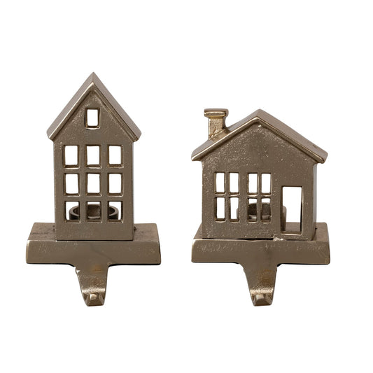 Two gold cast aluminum house-shaped tealight stocking holders, tall and short styles