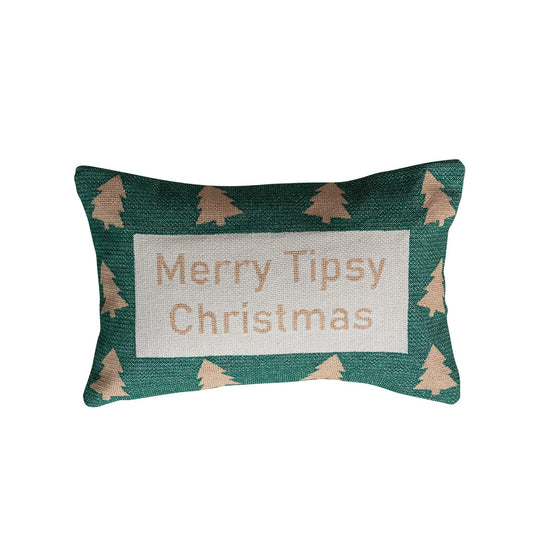 Green lumbar pillow with tan Christmas trees and Merry Tipsy Christmas text