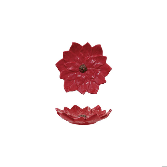 Red glazed ceramic poinsettia shaped plate shown from top and side angles
