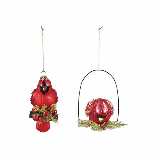 Two red glass cardinal Christmas ornaments with beads, glitter, and greenery accents