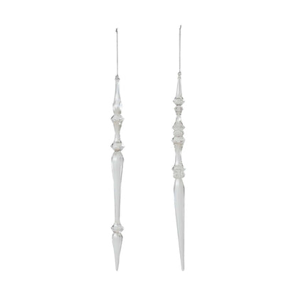 Two clear acrylic icicle Christmas ornaments with decorative detailing, hanging on silver strings