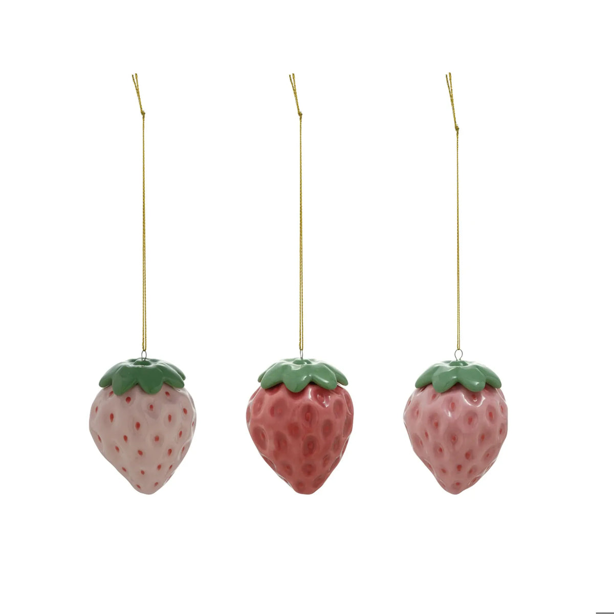 Three ceramic strawberry ornaments in light pink, rose, and mauve with green tops and gold string
